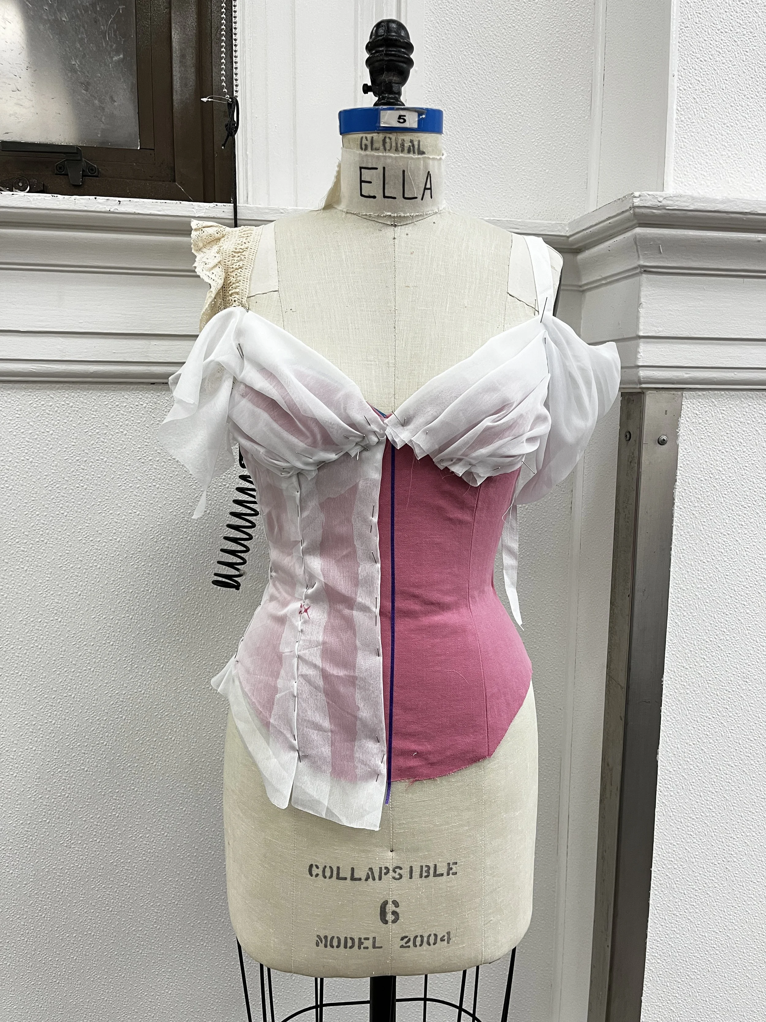 Corseted zip up dress, with decorative front lace up and draped skirt. Measured and sewn to my measurements. Designed, flat patterned, and constructed in 2024.