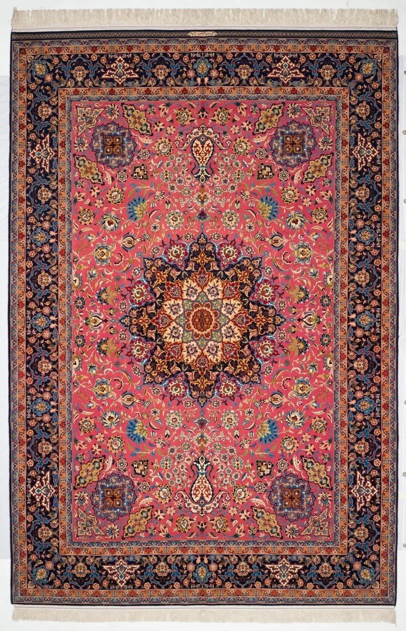 Shahabpour workshop Isfahan carpet with a rose field, indigo border and central medallion