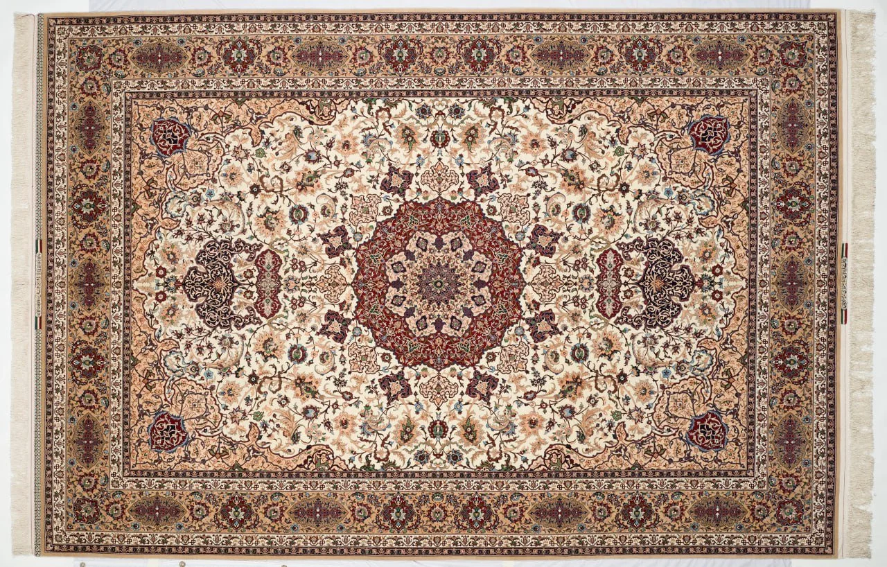 Hand-knotted Isfahan carpet with ivory field and red medallion