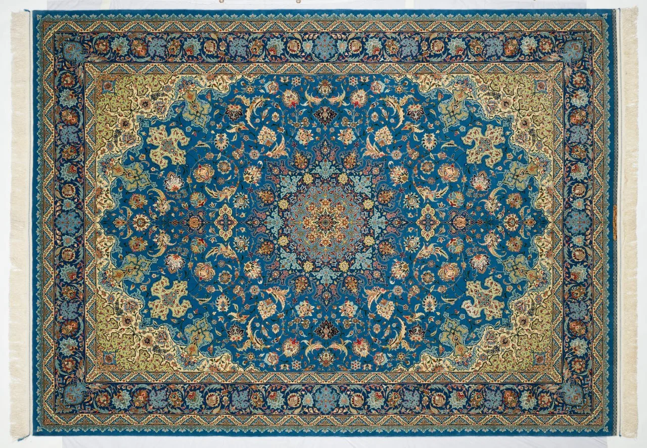Hand-knotted Isfahan carpet with blue field and dense floral design