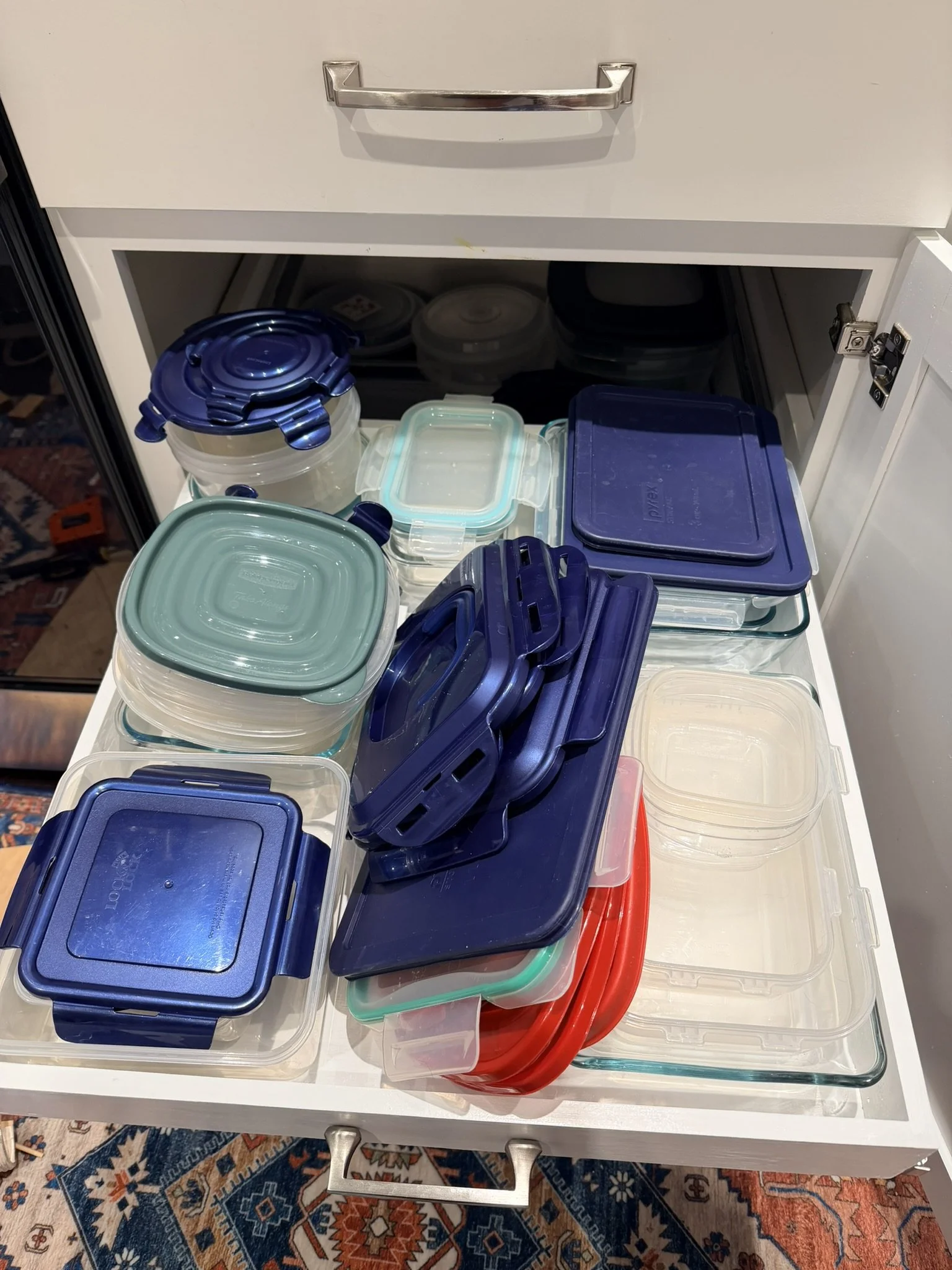 Pullout cabinet drawers easing storage challenges.