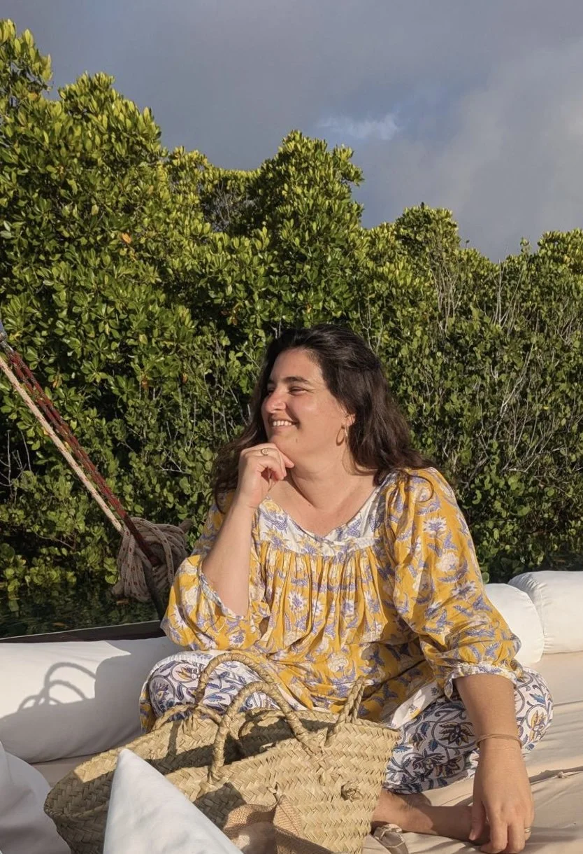Woman smiling on a boat with mangrove background