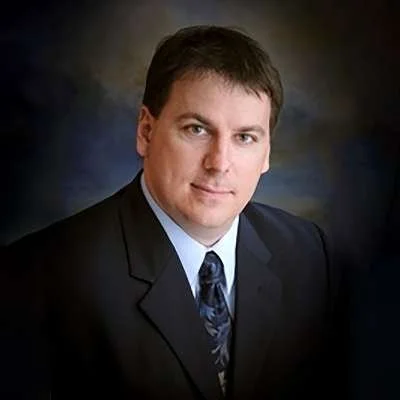 Dr. Dustin Burgess, music director of the Roman Festival Brass Band. Offical photo