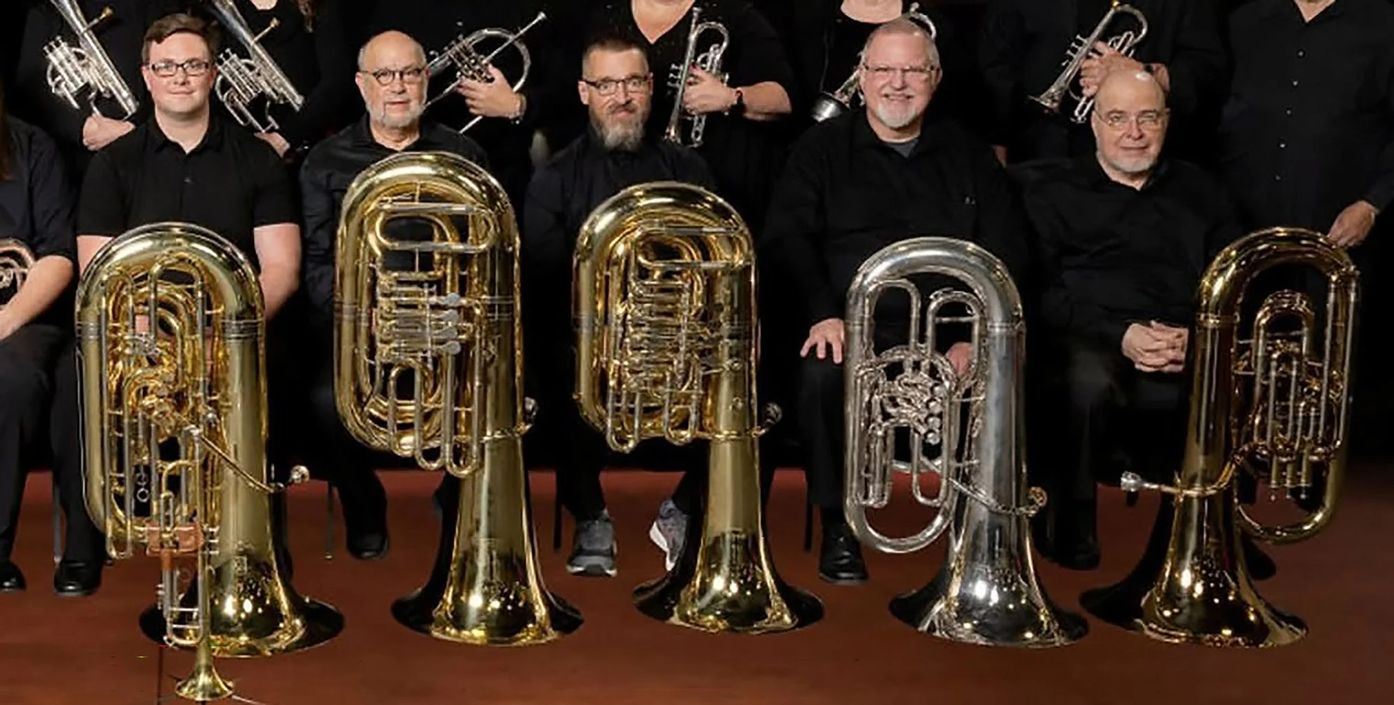 The bases or tuba section of the Roman Festival Brass Band. Two sizes and pitches are used. B flat and E flat tubas