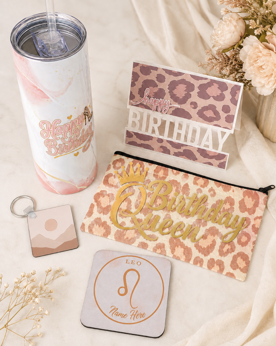 Personalized birthday gift set with custom tumbler, pouch, cards, and zodiac details