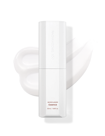 A skincare product, specifically a white bottle labeled 'microfludizer Essence' with a cap and a dropper attached, placed on a white surface.