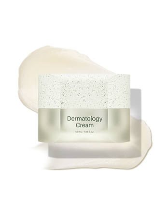 A container of dermatology cream with a spatula coated in cream resting on its lid.