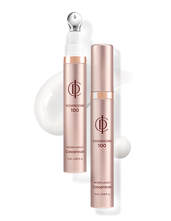 Two pink skincare bottles labeled 'Radiance' and 'Concentrate' with white and gold accents, along with white cream on a black background.