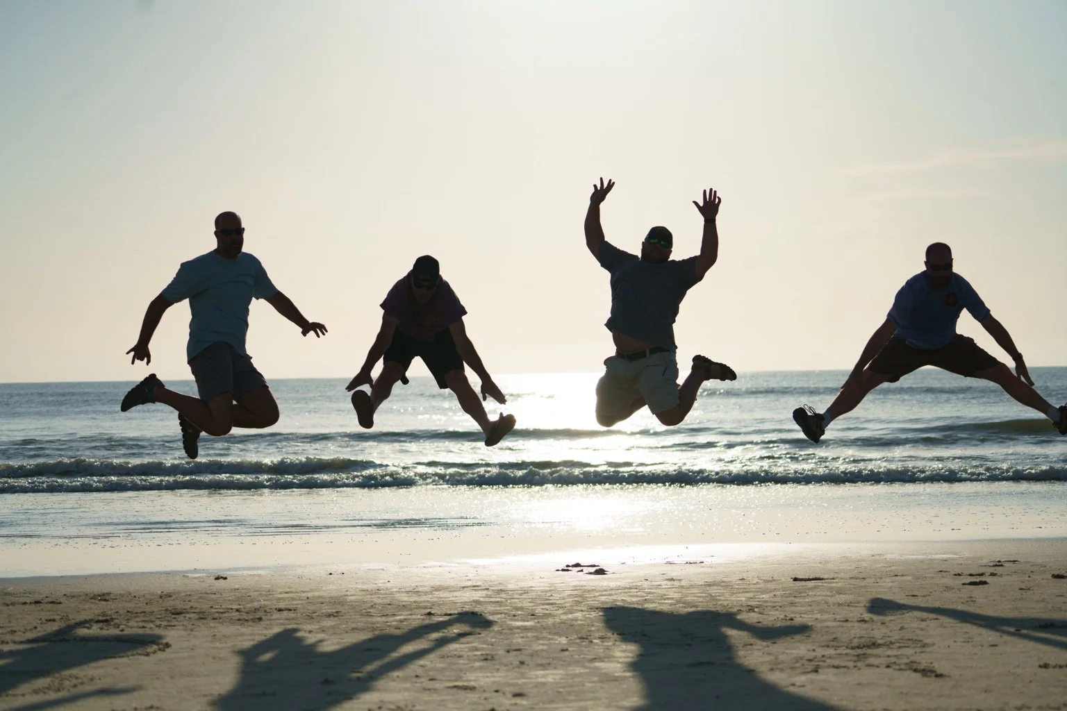 Dancers expressing themselves together at the beach