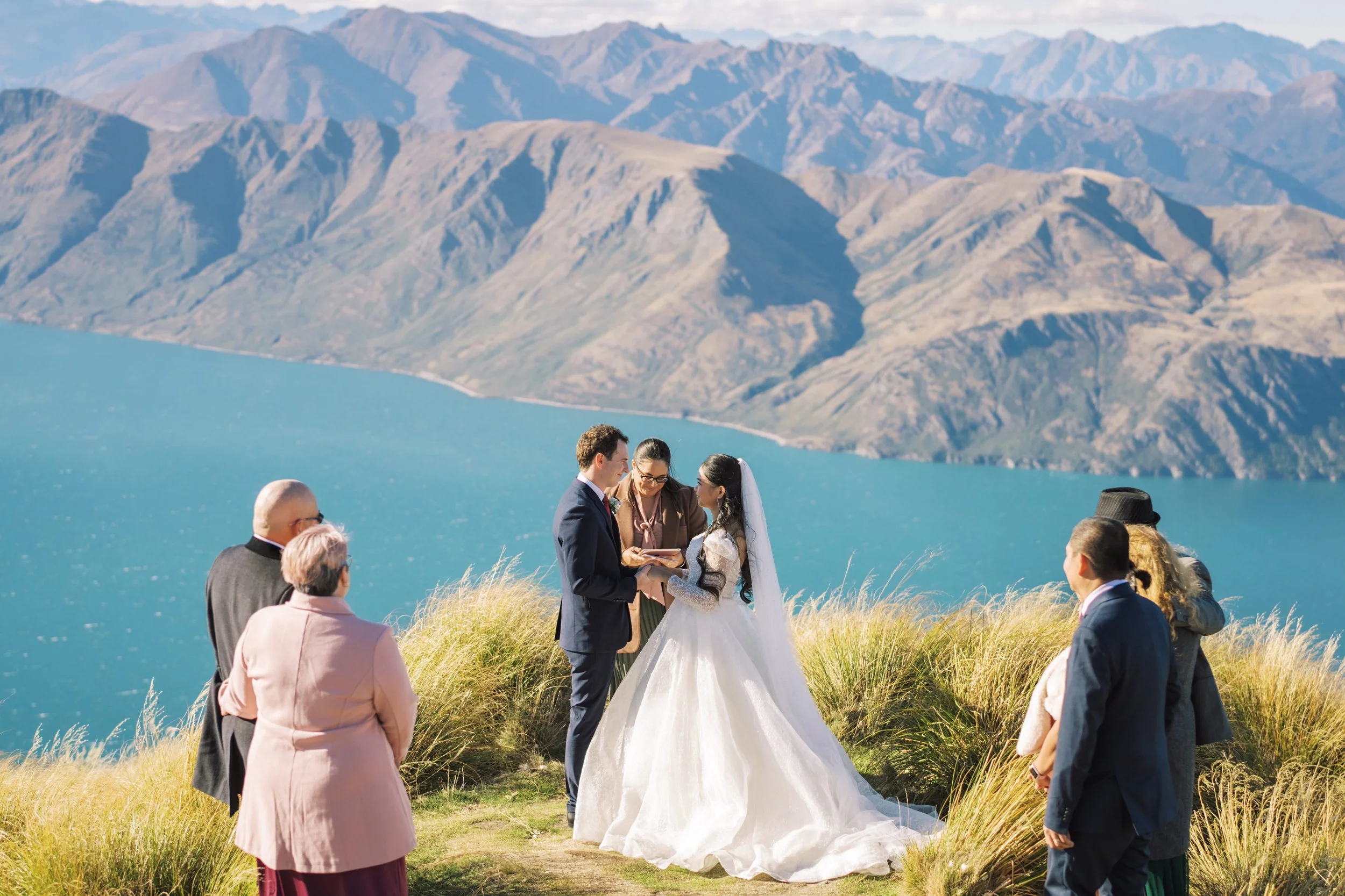 Bride and groom exchange vows at Coromandel peak, Wanaka