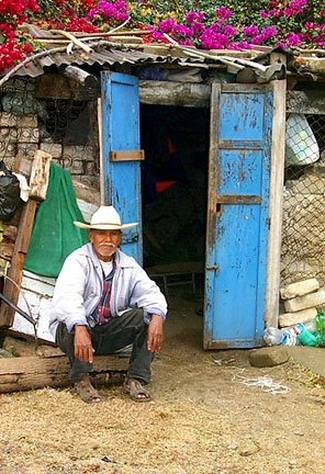 fisherman in front of his abode