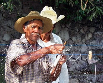fisherman working on net