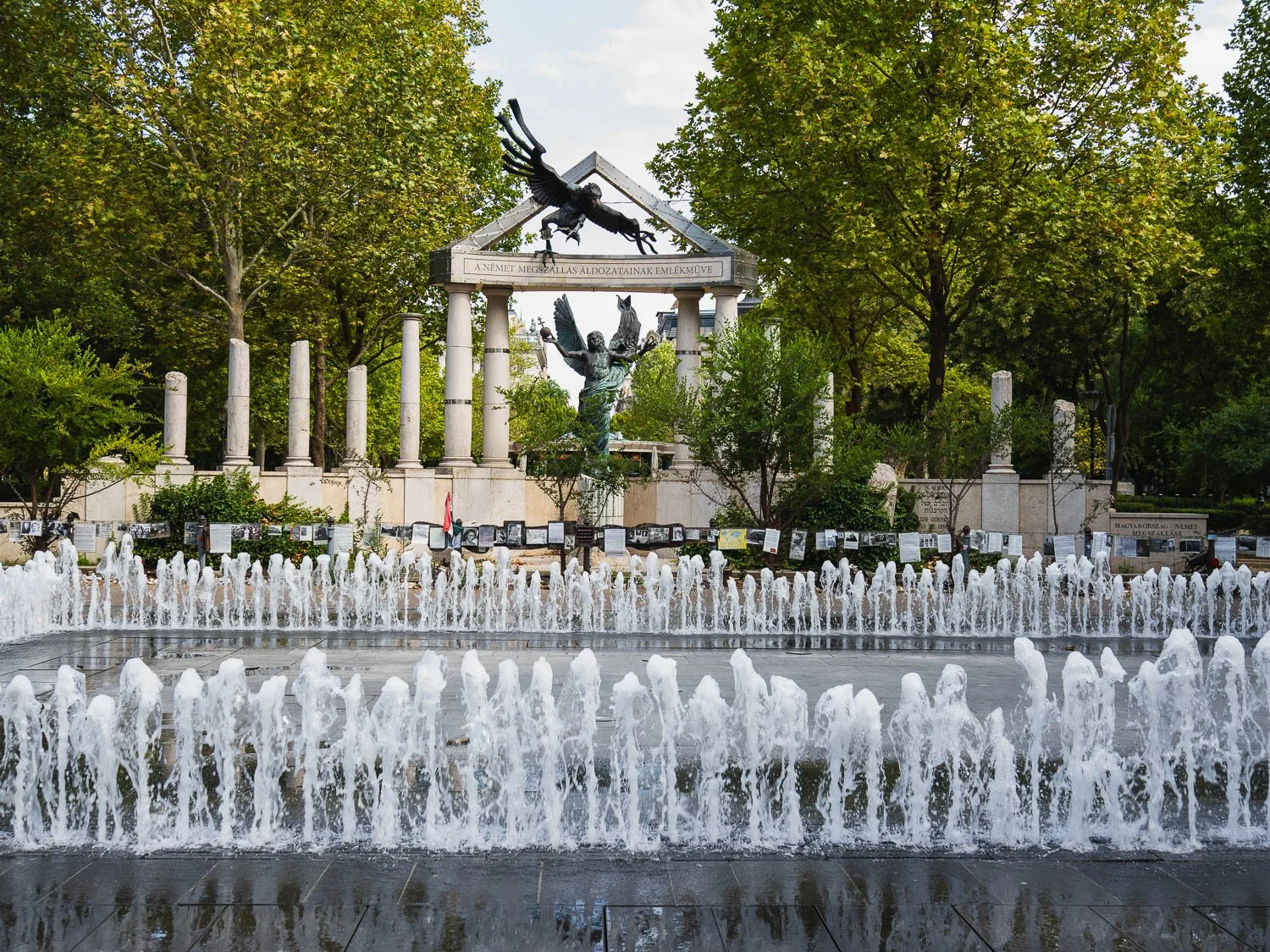 Memorial to the Victims of the German Occupation on Szabadság tér, Budapest, with rows of fountain jets in the foreground