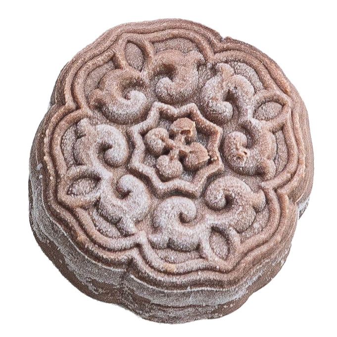 A round mooncake with intricate floral and swirl patterns on top, dusted with powdered sugar.