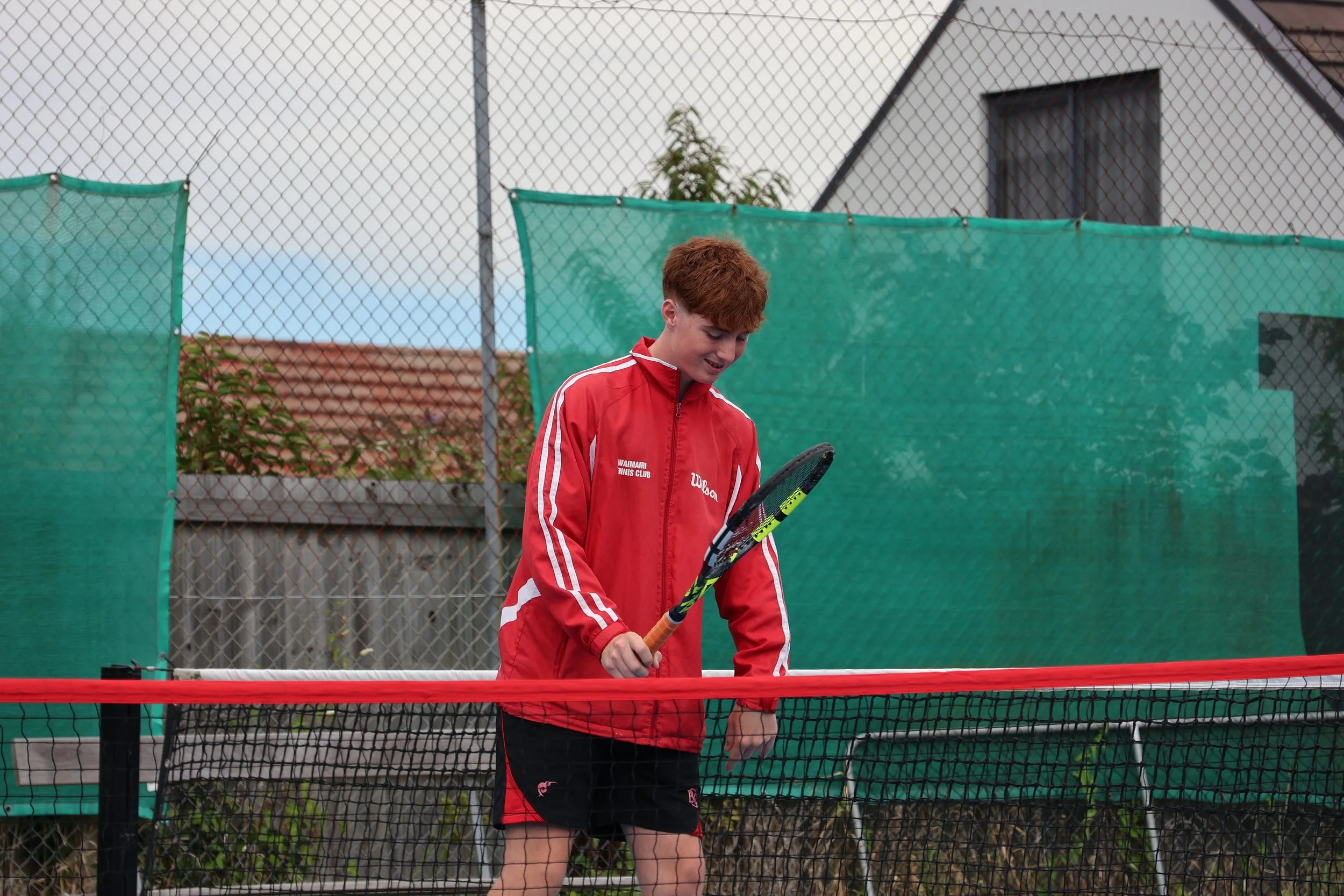 Adult tennis player practising a forehand on court