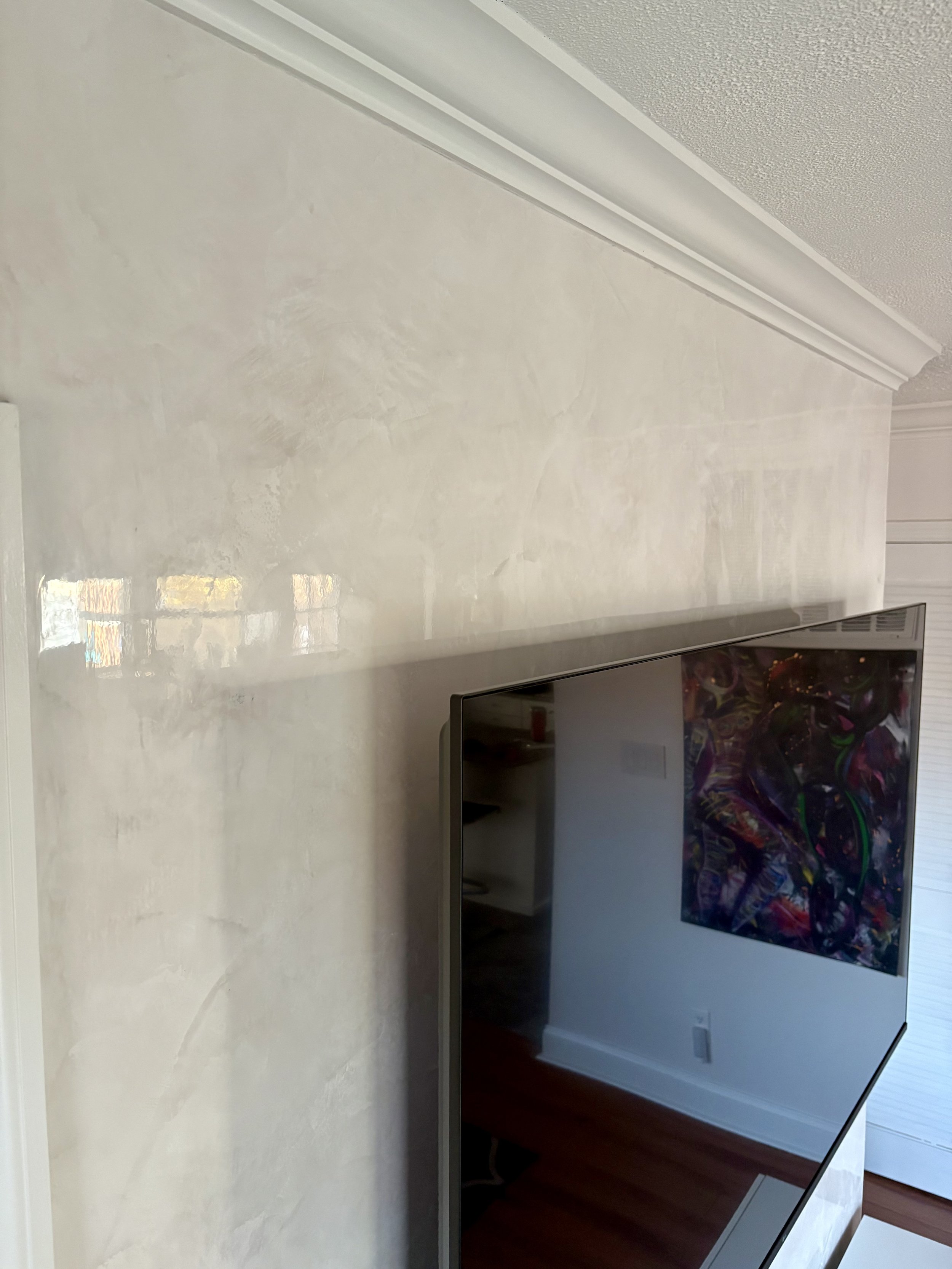 Polished Venetian plaster feature wall with subtle movement and depth.