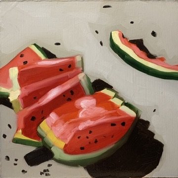 Painted slices of watermelon on paper