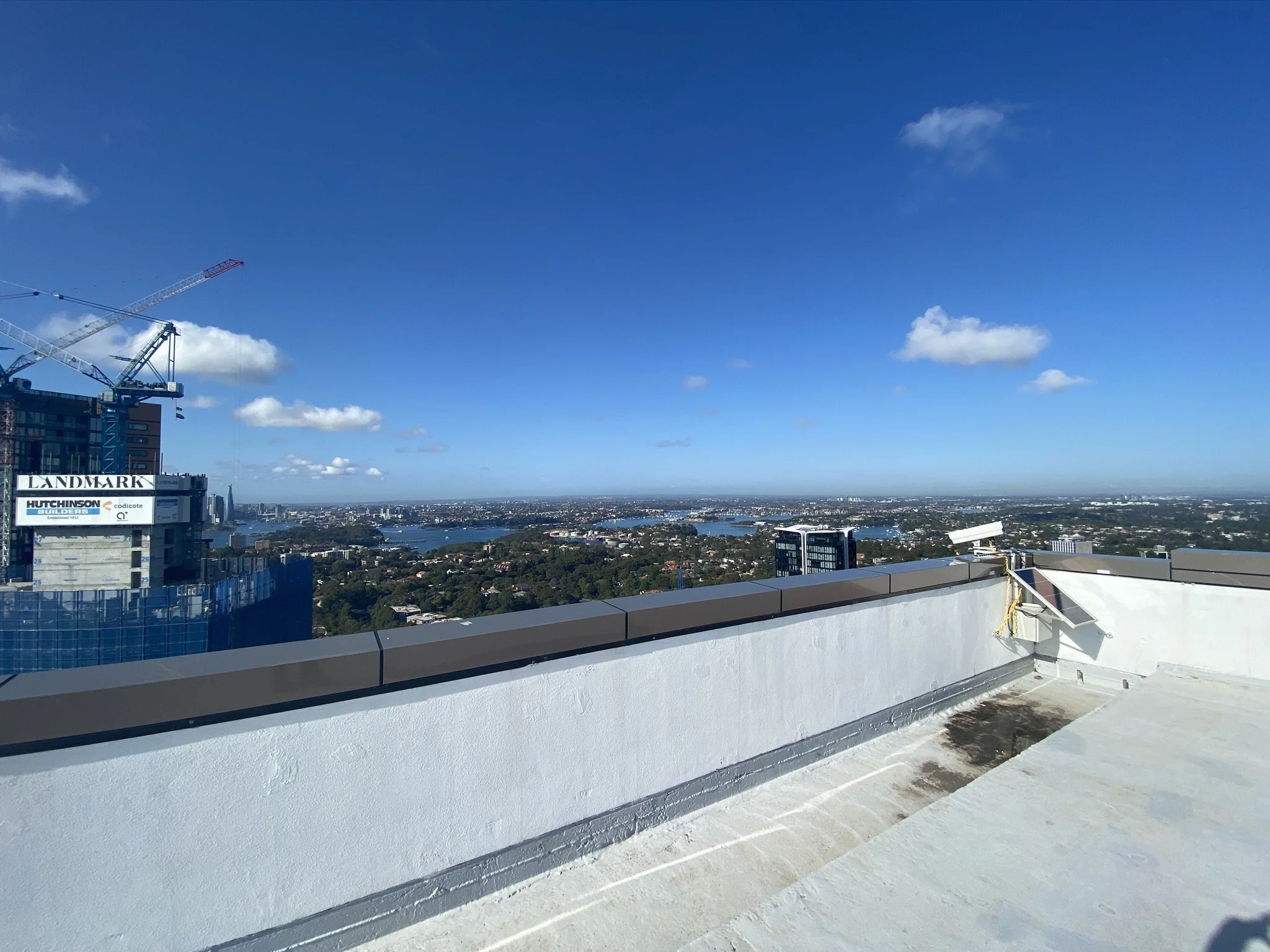 Rooftop of a high-rise building with views across the city