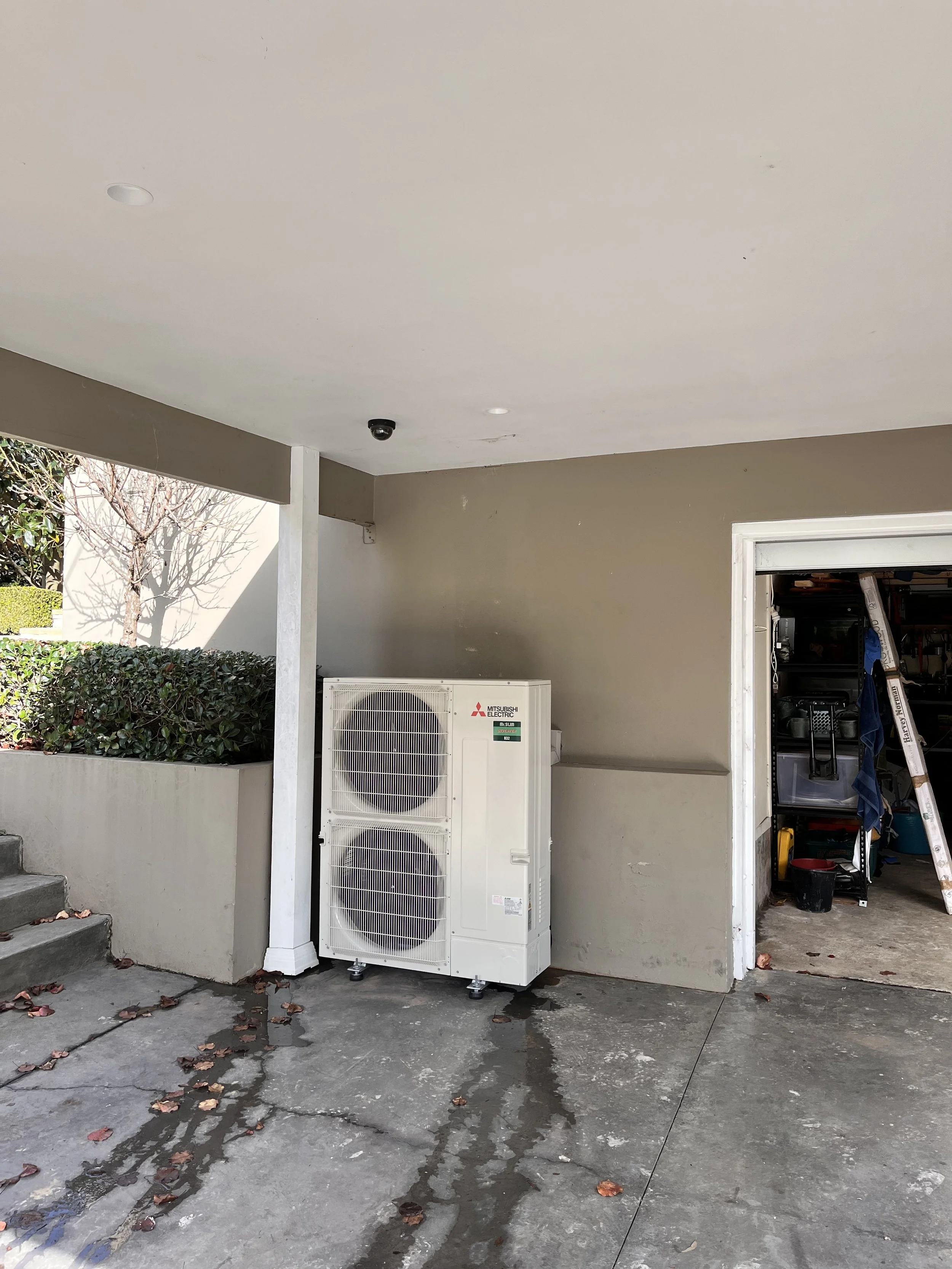 Twin-fan outdoor unit in a carport