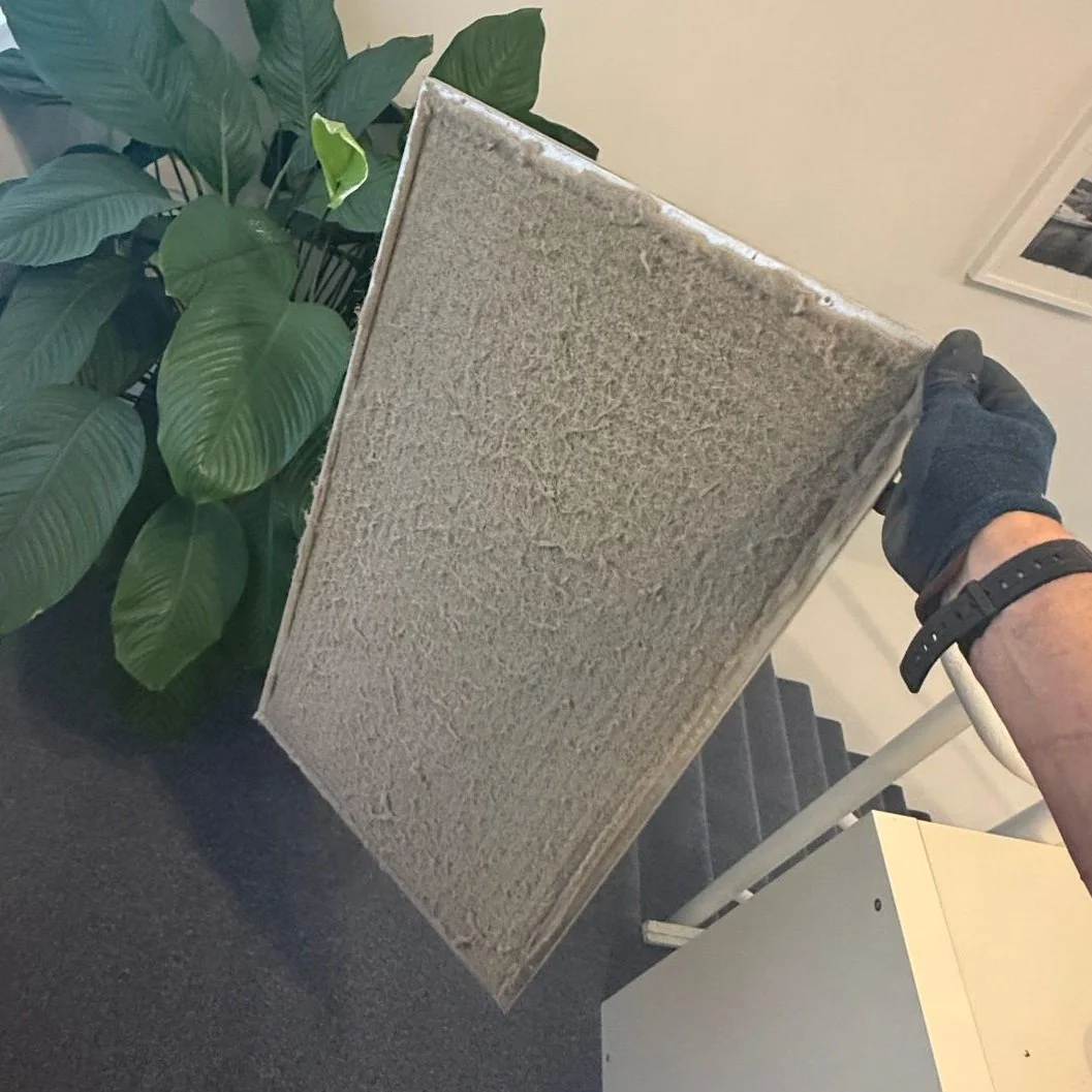 a photo showing a blocked filter for a ducted ac