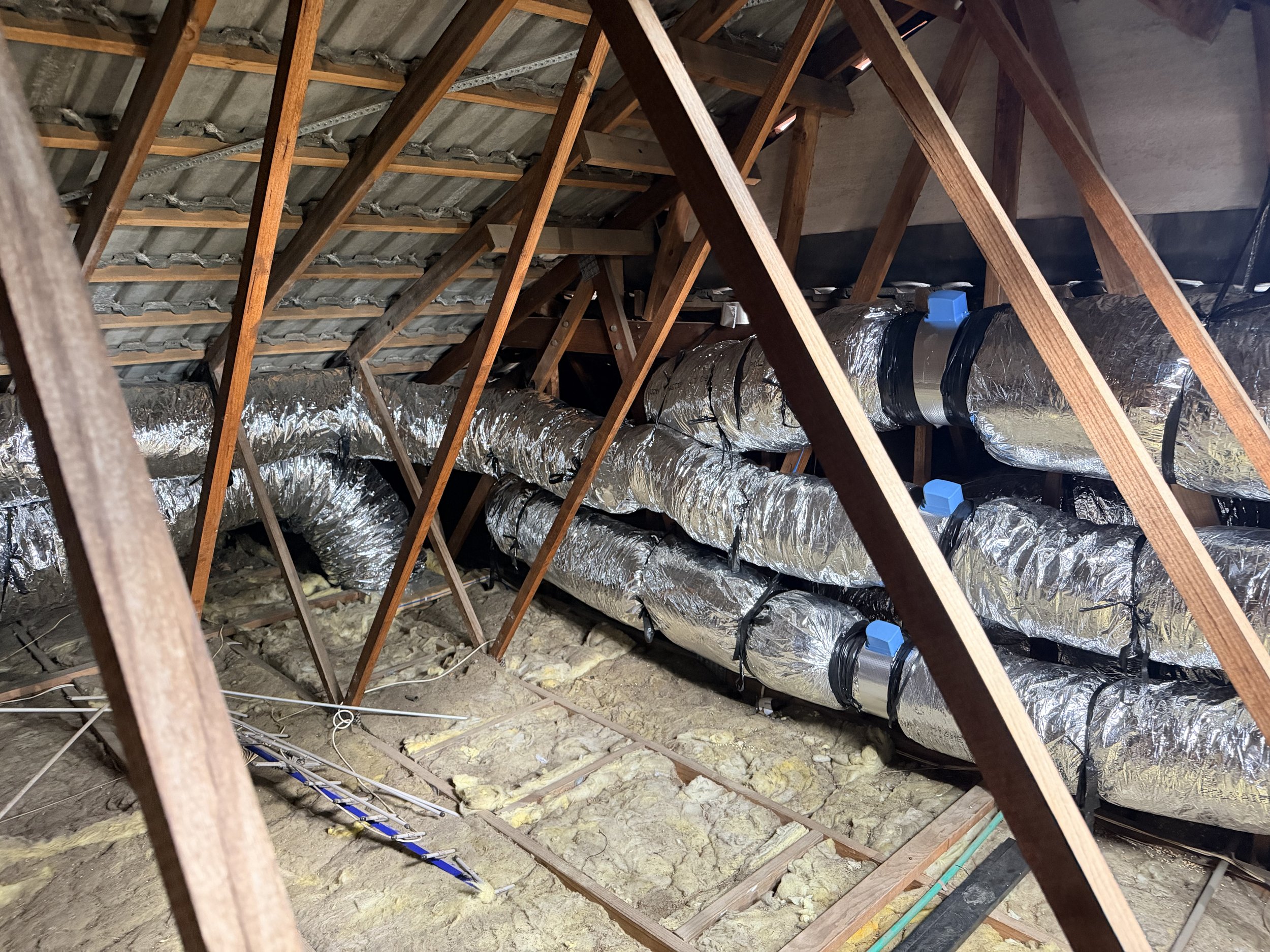 a photo showing ductwork neatly installed in a roof
