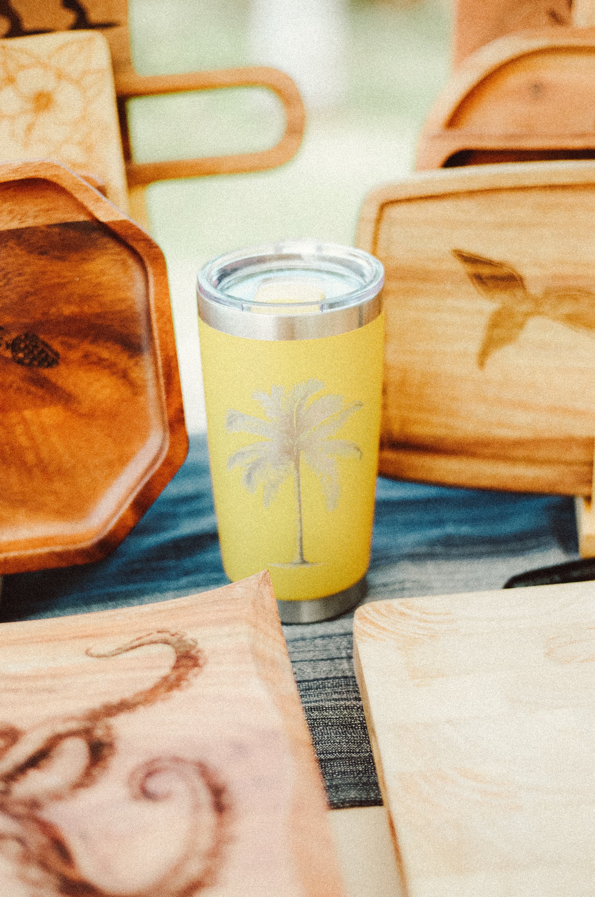Yellow travel tumbler engraved with palm tree design made on Oahu Hawaii