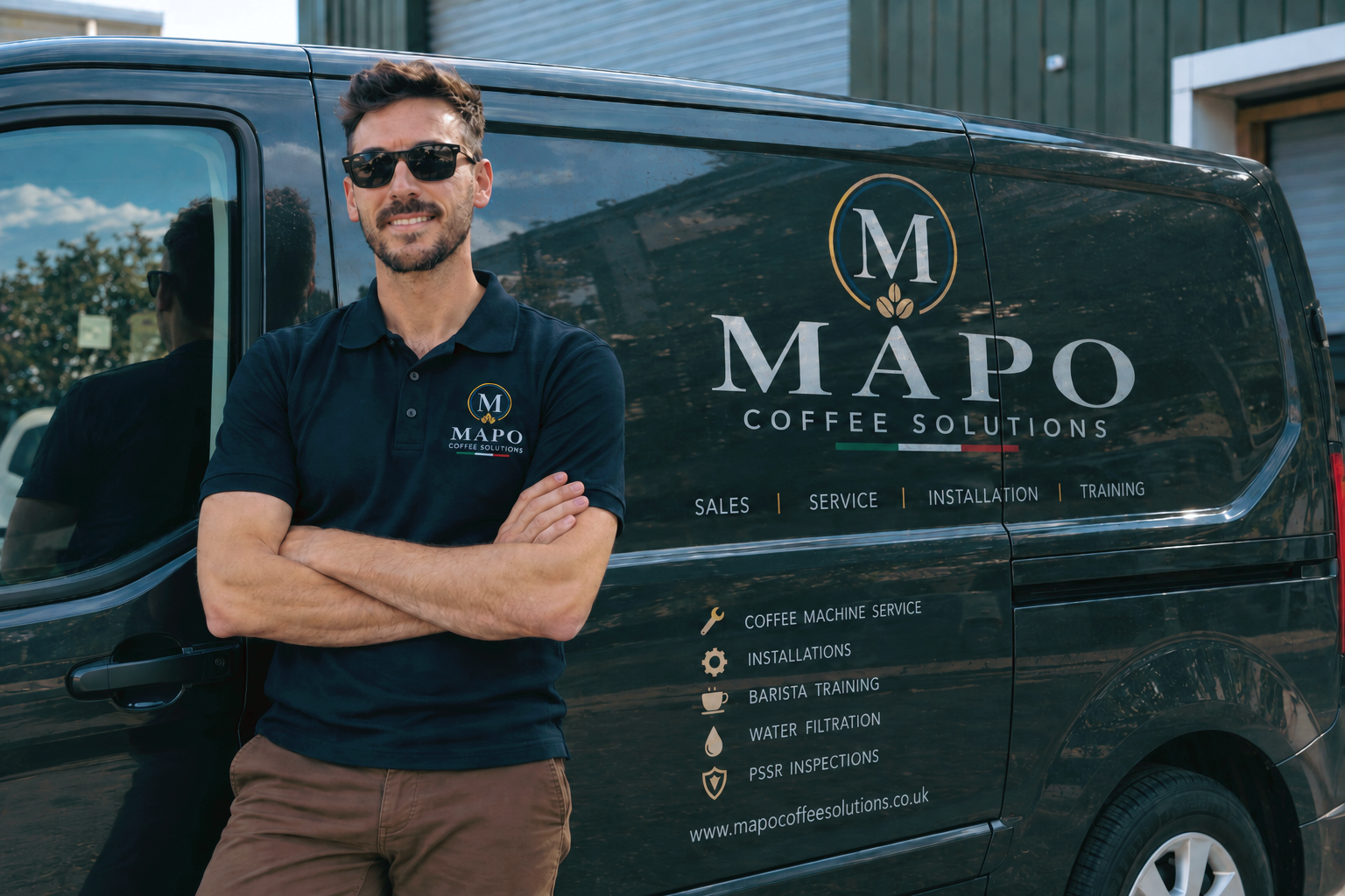 A man in sunglasses wearing a navy polo shirt with the MAPO Coffee Solutions logo stands with arms crossed in front of a black van with the company's branding and service information.