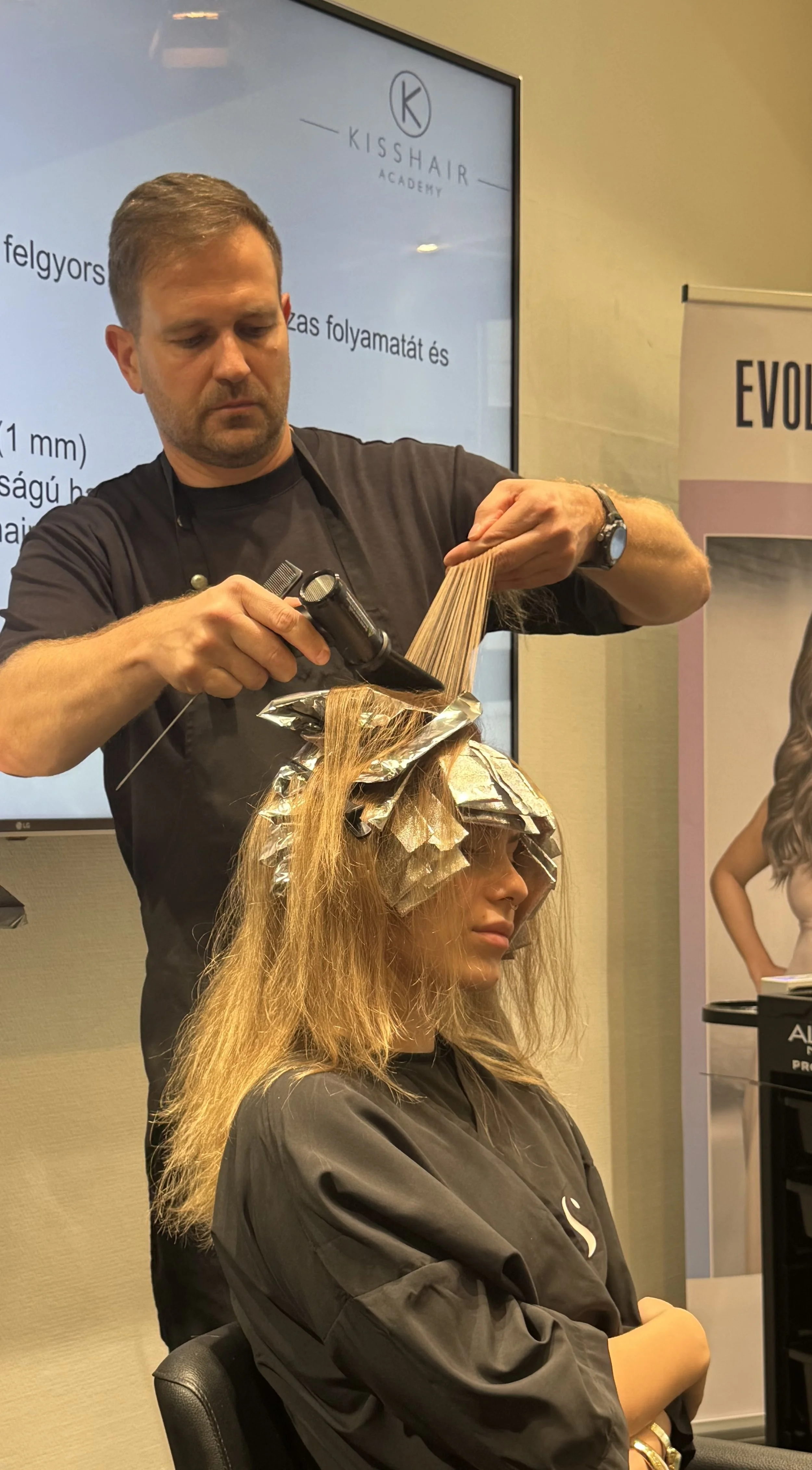 Master hairstylist Janos Kiss demonstrating a Airtouch colour technique at a hair education event