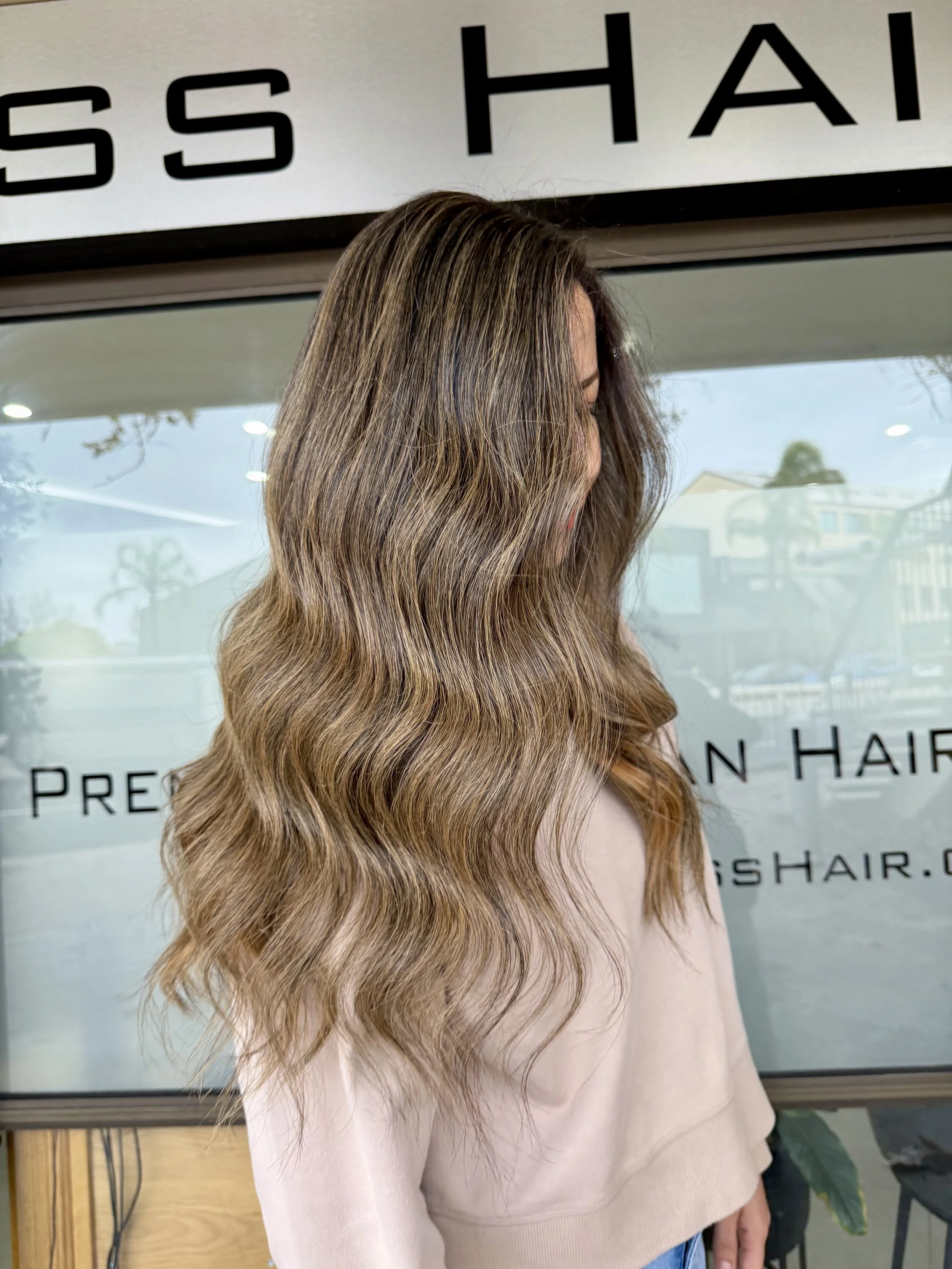 Long wavy brunette hair with soft caramel Airtouch highlights, colour by Janos Kiss Hair, Cremorne