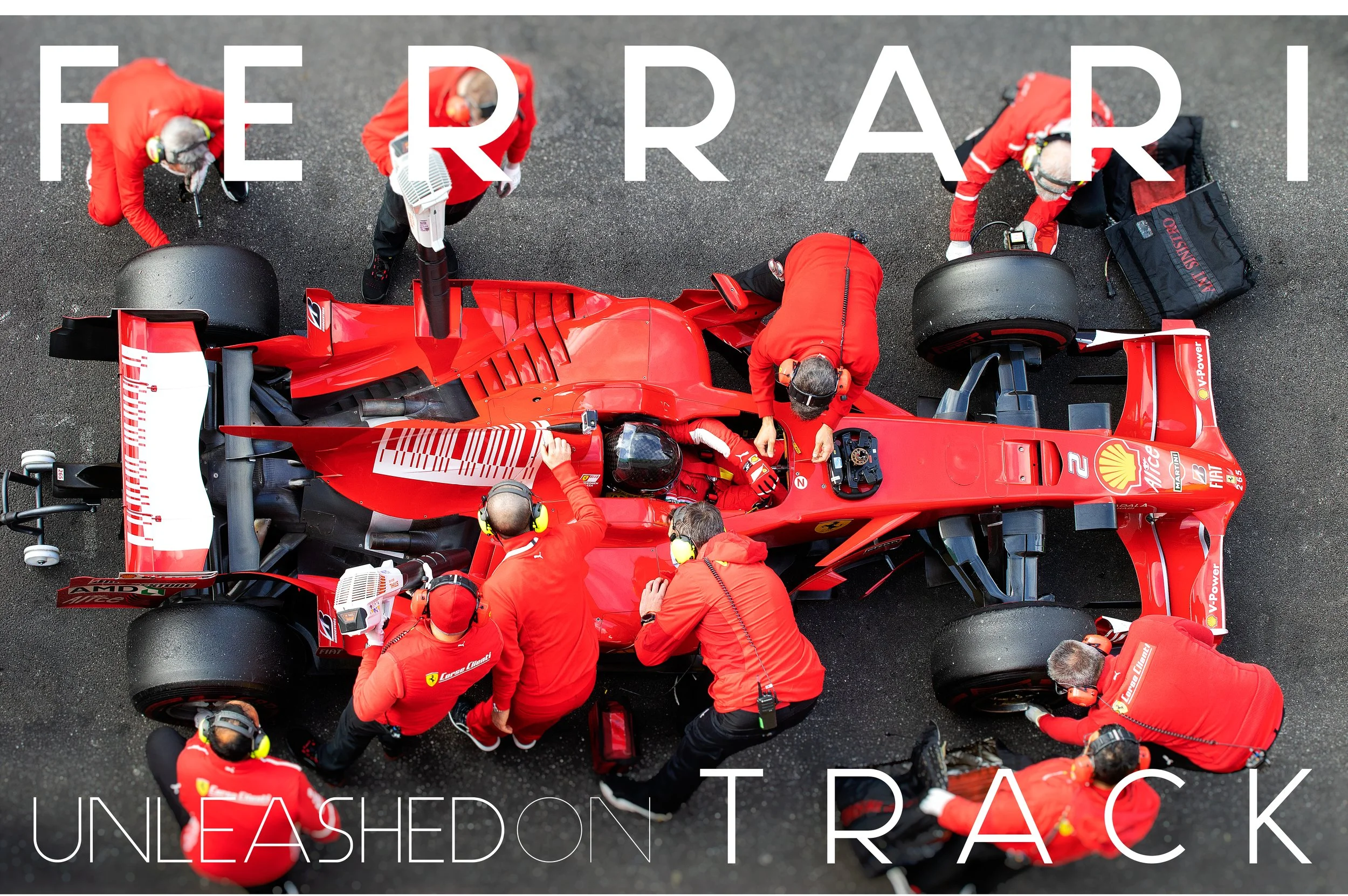 Overhead view of a red Formula 1 race car in the pit lane, surrounded by a team of mechanics and engineers wearing red uniforms and headsets, working on the car.