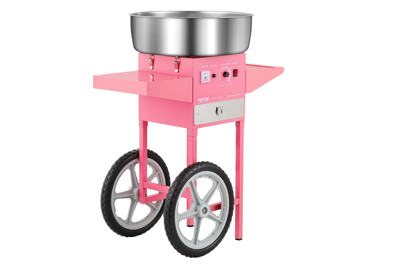 Machine de confection de nougat rose avec une cuve en métal en haut, deux roues en dessous, boutons et interrupteurs sur le panneau frontal.