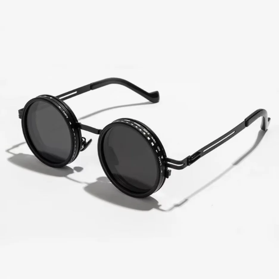 Black round sunglasses with dark lenses on a white background.