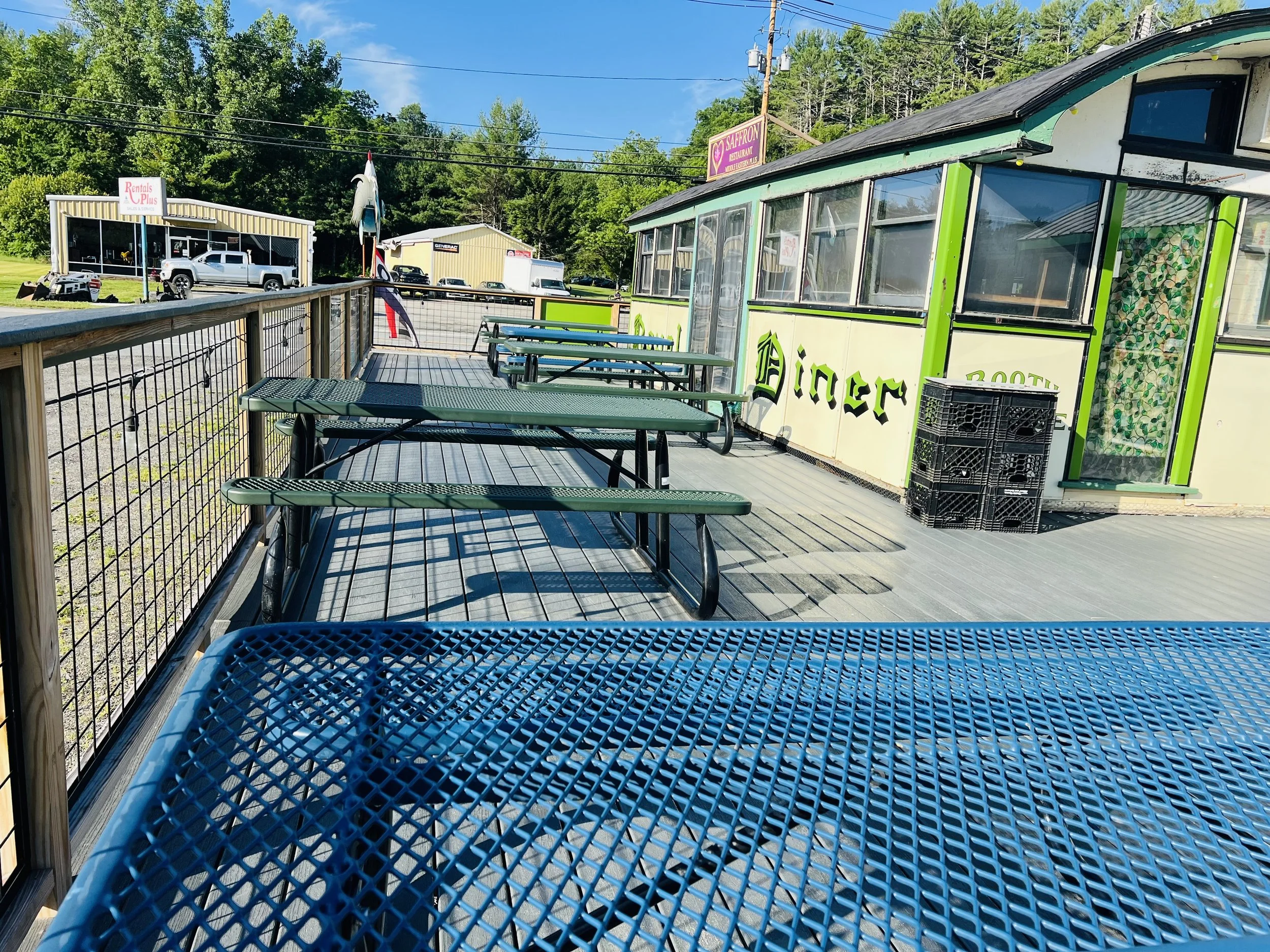 Wooden deck patio with outdoor tables at Royal Diner, West Brattleboro VT