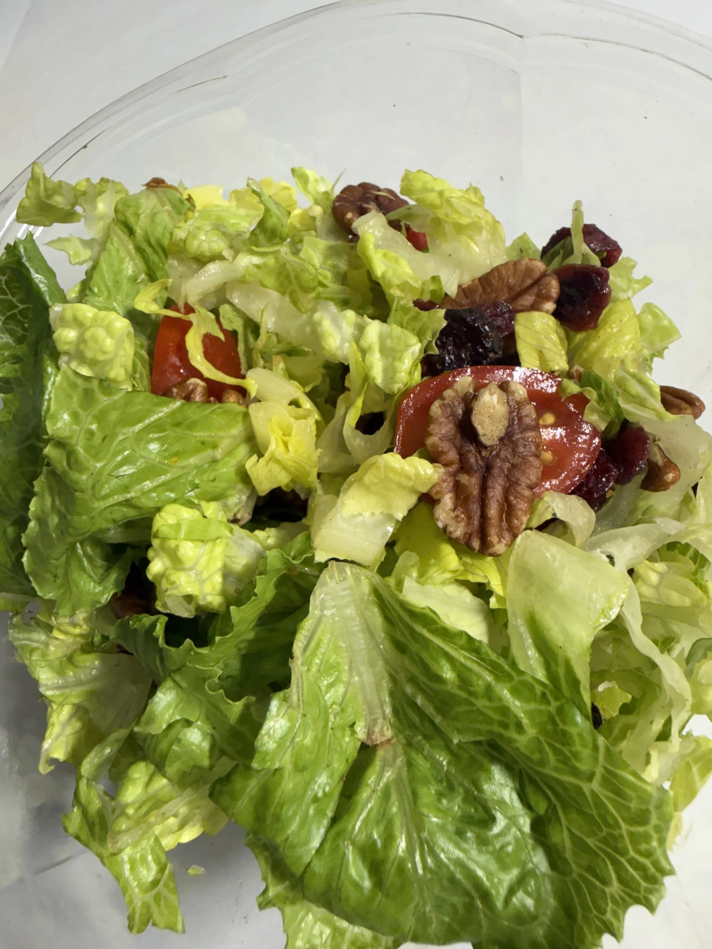 Green salad with cherry tomatoes, pecans and dried cranberries at Royal Diner