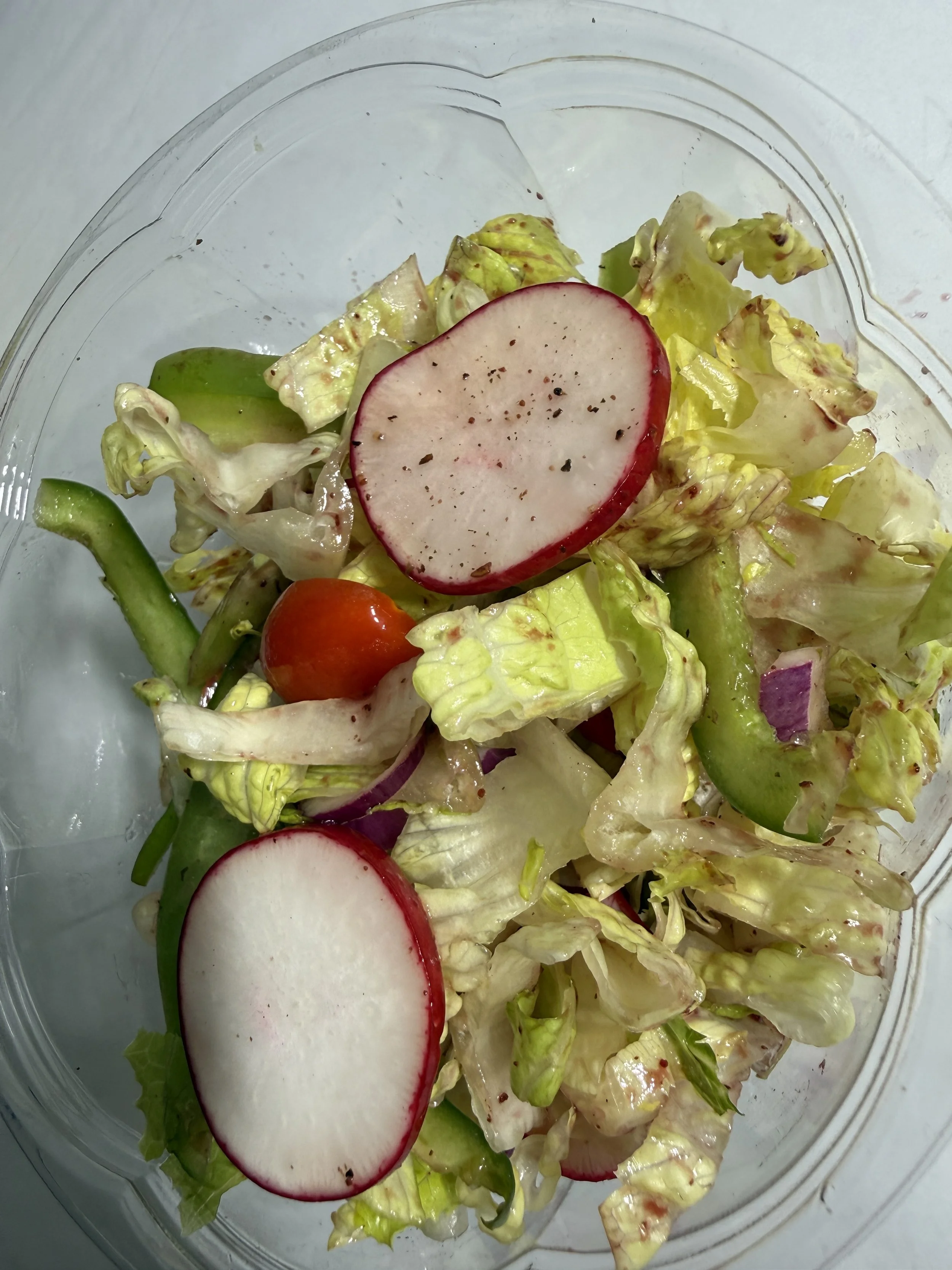 Garden salad with radish, cherry tomatoes, cucumber and lettuce at Royal Diner