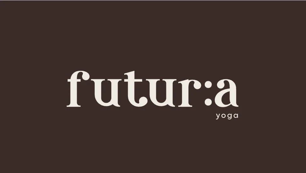 Logo for futura yoga with the words 'futura' in large white font and 'yoga' in smaller font on a dark background.