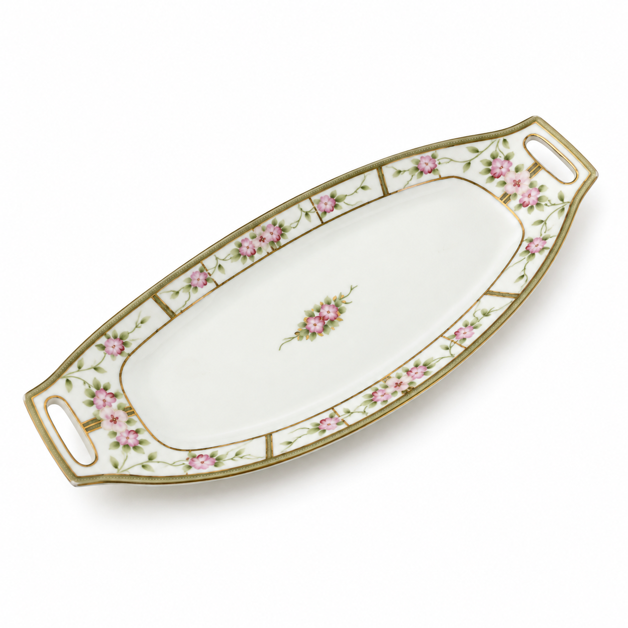 Made by Nippon, a pierced handle, pink blossoms and  gold detailing.