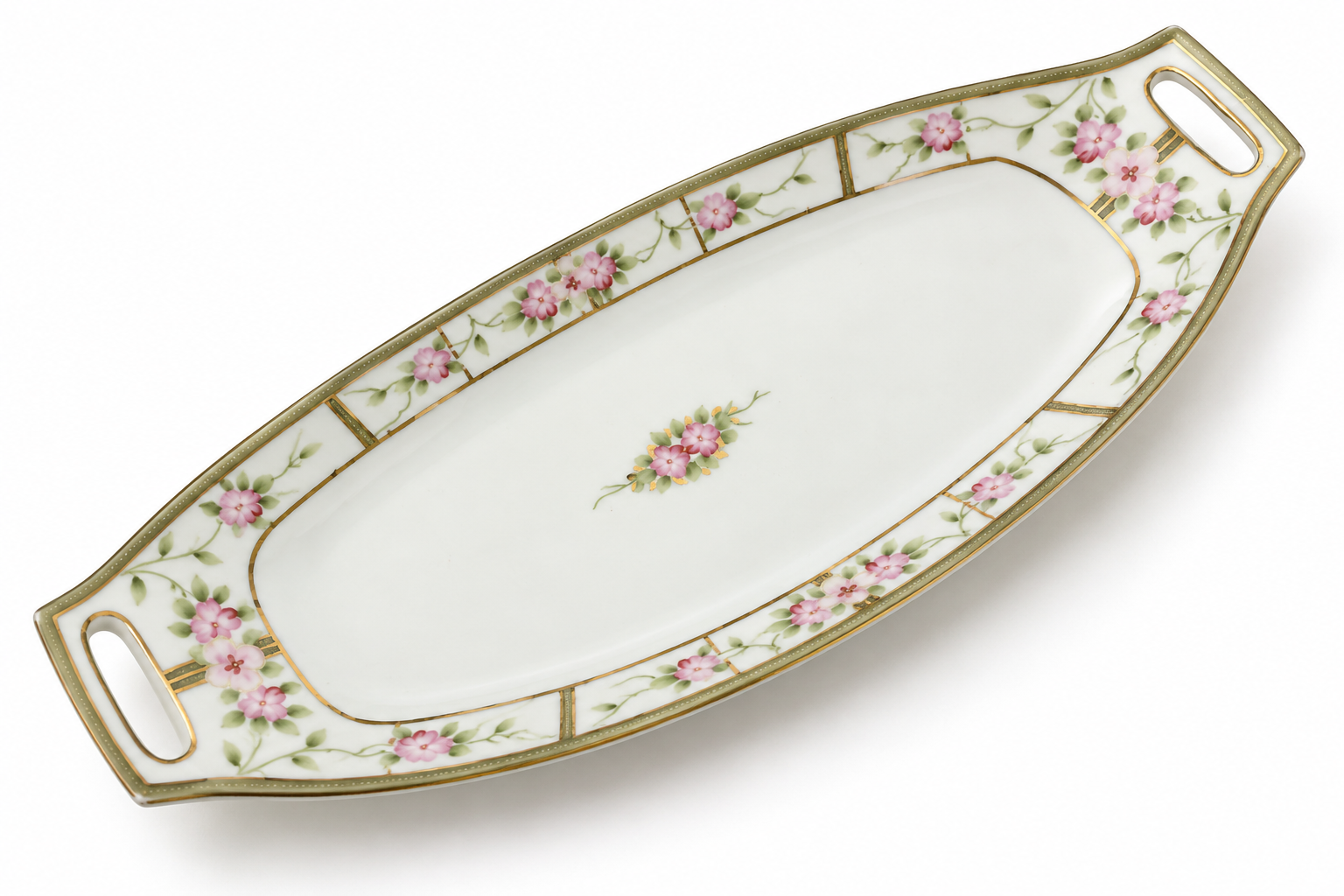 Close-up of the tray’s pierced handle, pink blossoms and worn gold detailing.