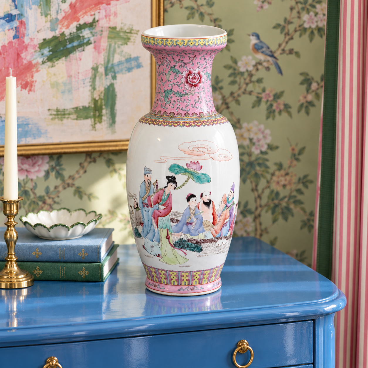 Pink figural porcelain vase holding white hydrangeas in a colorful grandmillennial interior.