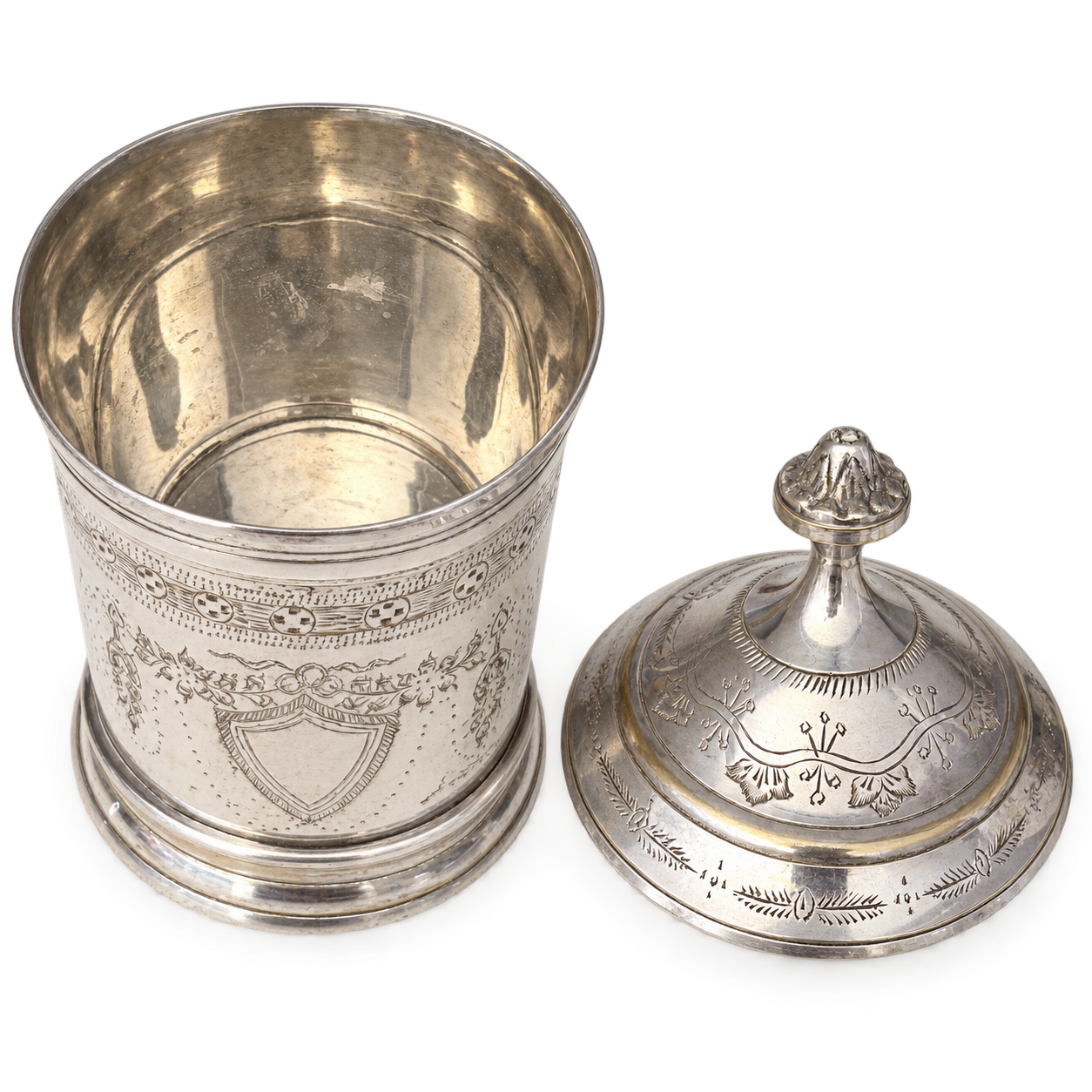 Open metal jar showing the interior and removable lid.