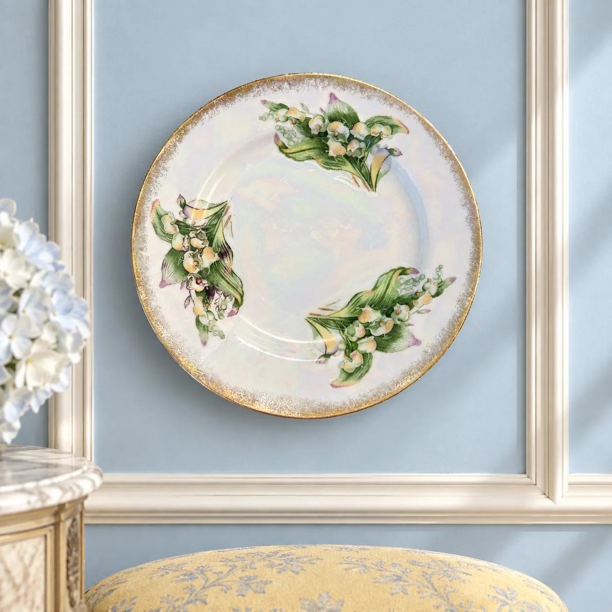 May floral plate displayed on a pale-blue paneled wall.
