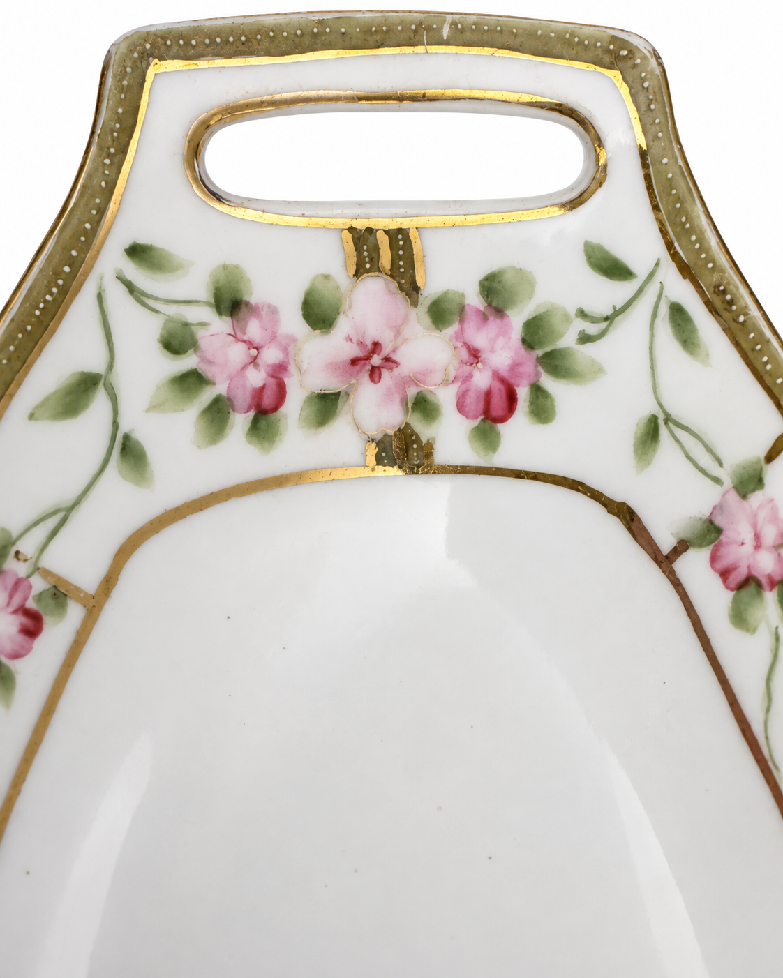 Close-up of the tray’s pierced handle, pink blossoms and worn gold detailing.
