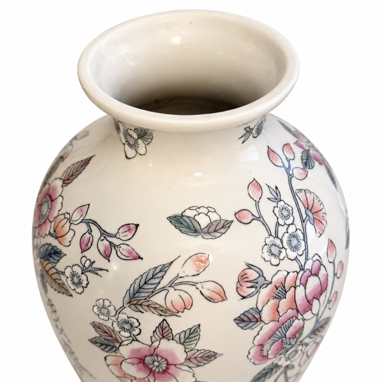 Close-up of the floral vase’s flared opening, ivory interior and rounded shoulders.