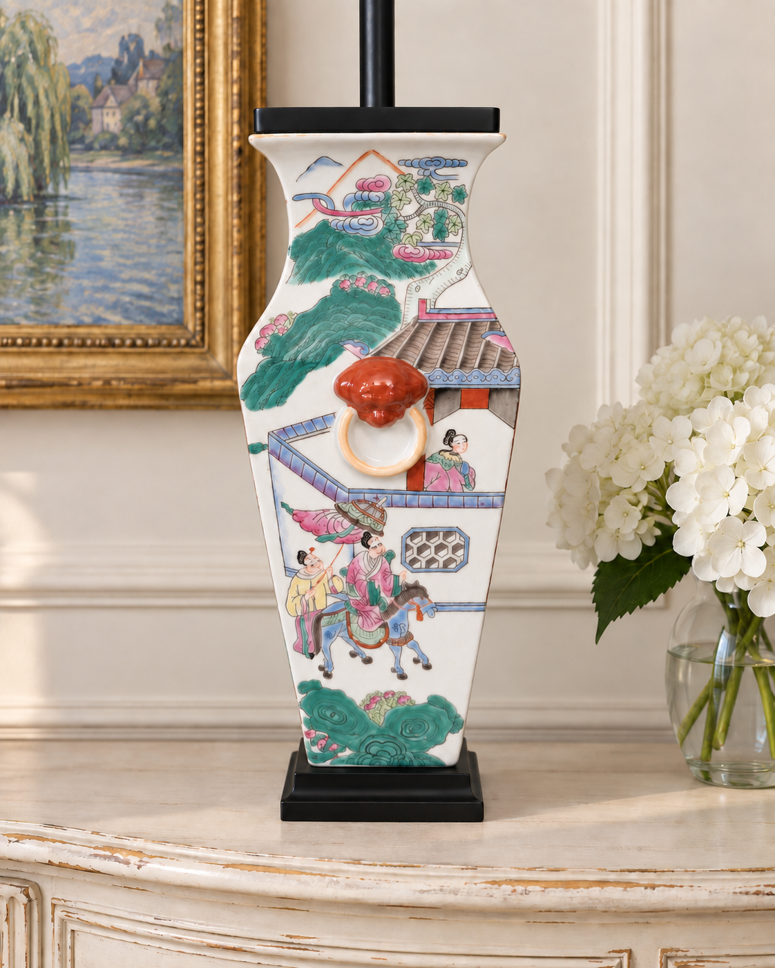 orcelain lamp body with colorful court figures, a flared neck, and black pedestal.