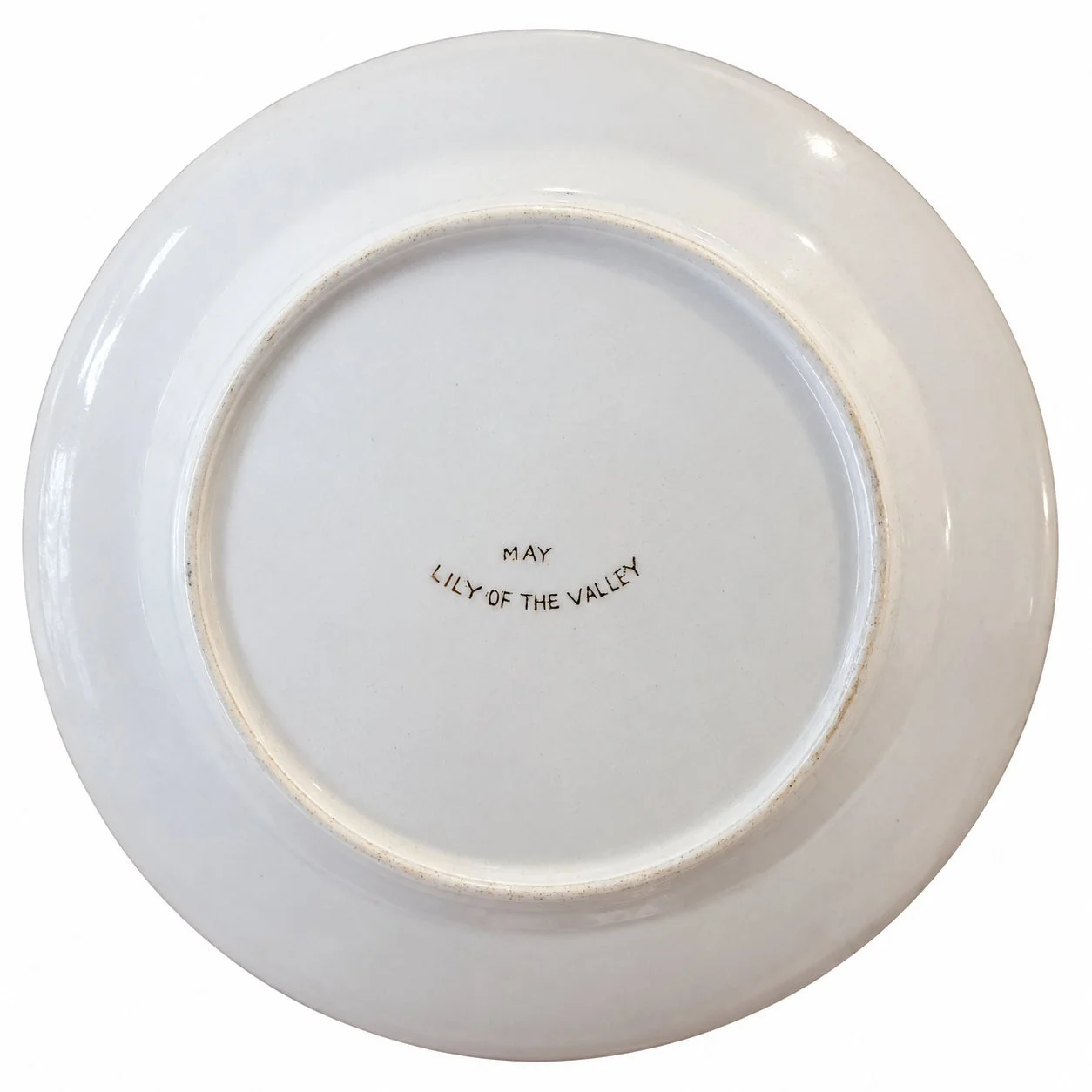 Reverse of the plate marked May Lily of the Valley.