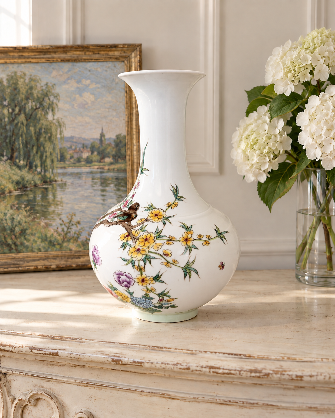 6.pngPorcelain bird and flower vase turned to show yellow blossoms, with wicker seating and a pink cushion in the background.