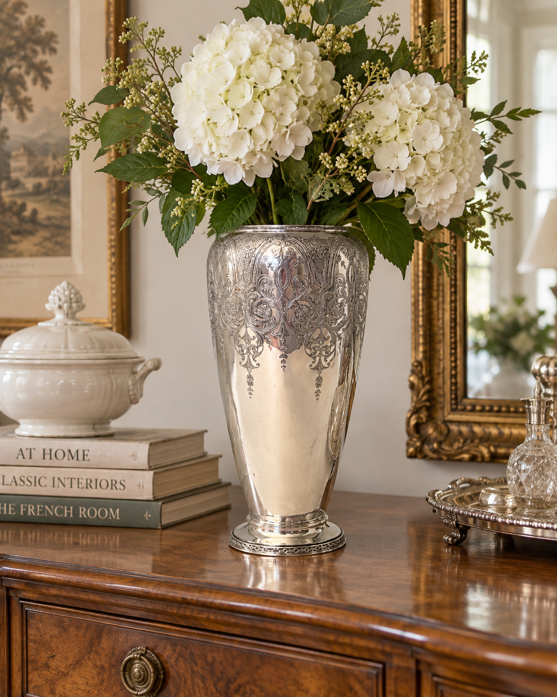 Vintage Wilcox silver-plated vase styled on a French country buffet with a soft collected antique aesthetic.