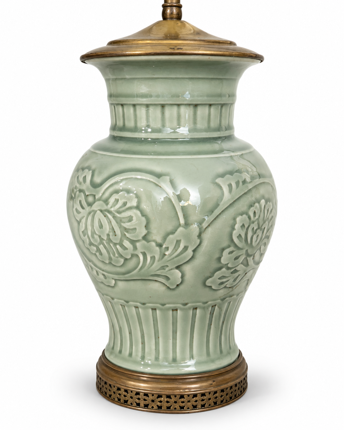Oval brass-tone lamp finial with scrolling openwork and visible surface patina.