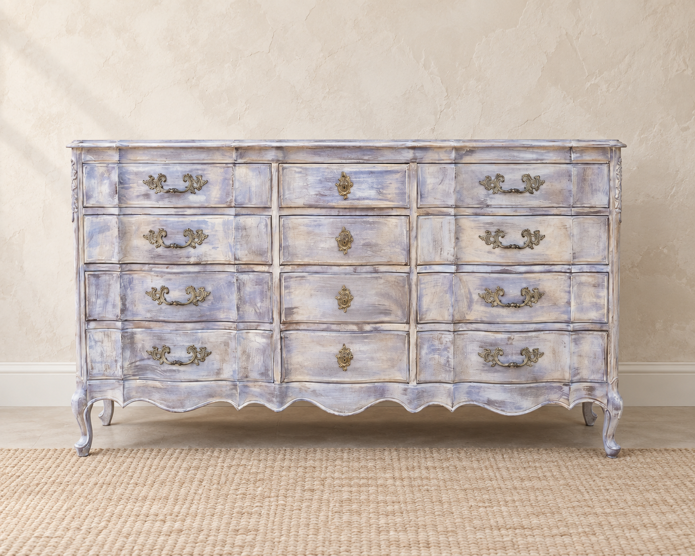 Long French Provincial dresser refinished in a layered lavender-gray wash with ornate brass hardware and cabriole legs