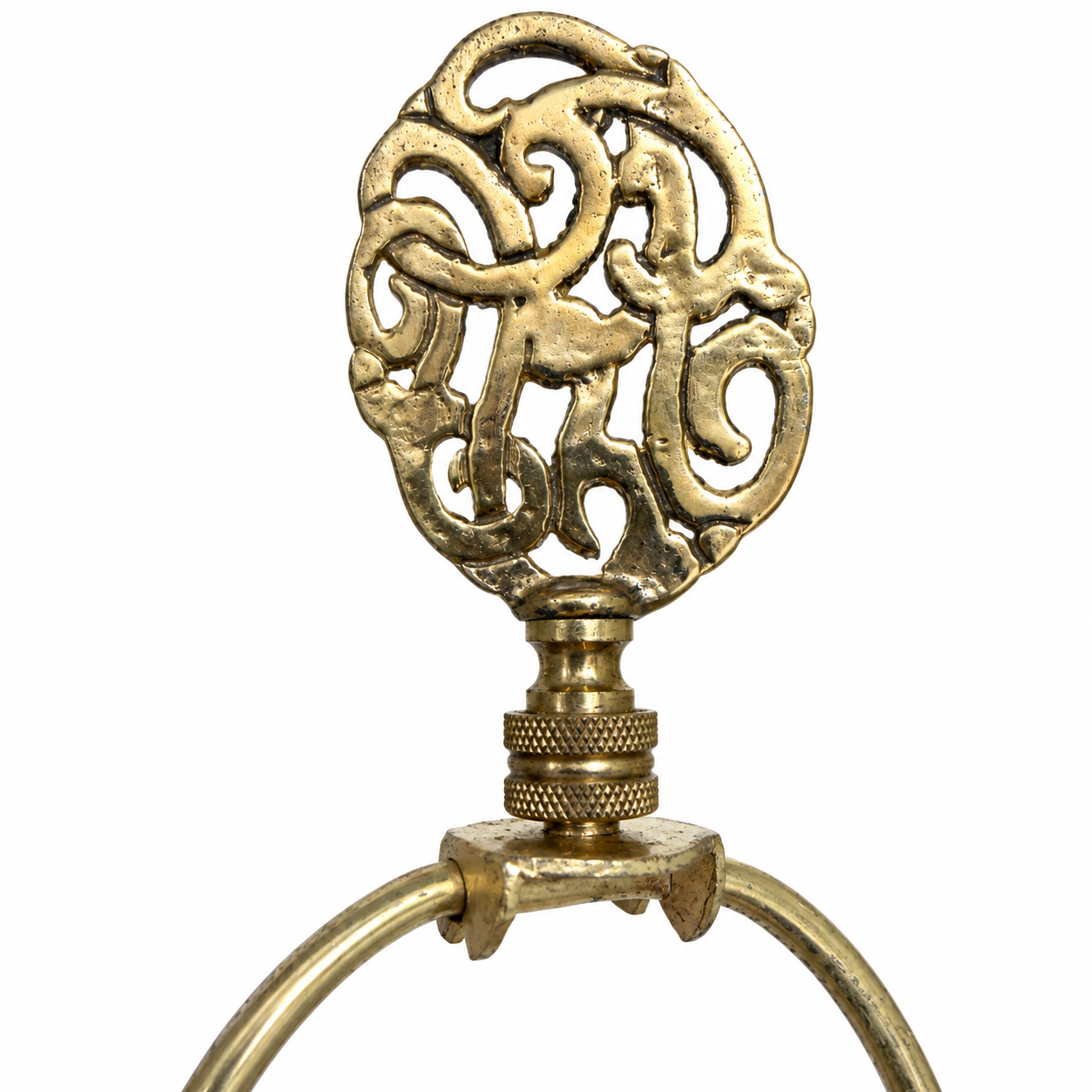 Close-up of celadon floral relief, ribbed detailing and the lamp’s pierced brass-tone base.